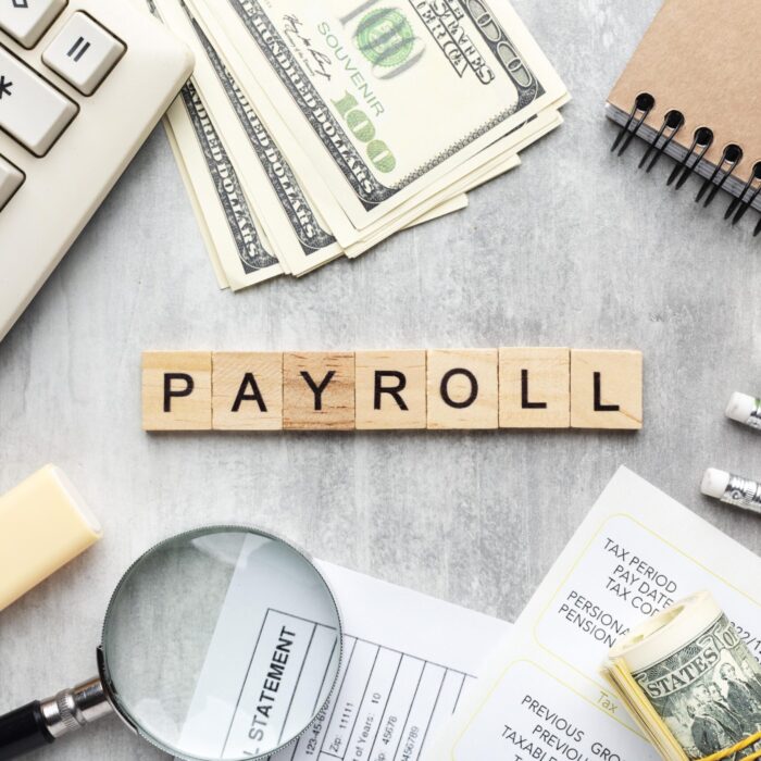 top-view-payroll-concept-with-items